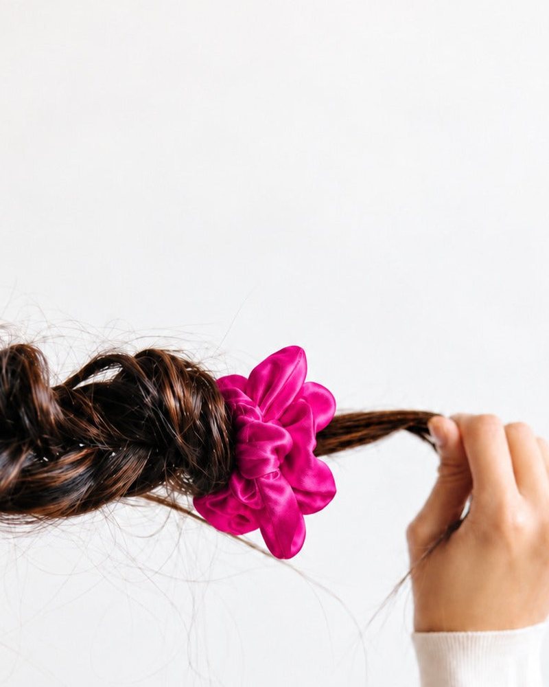 Close-up of the smooth silk on a Candy Dot scrunchie