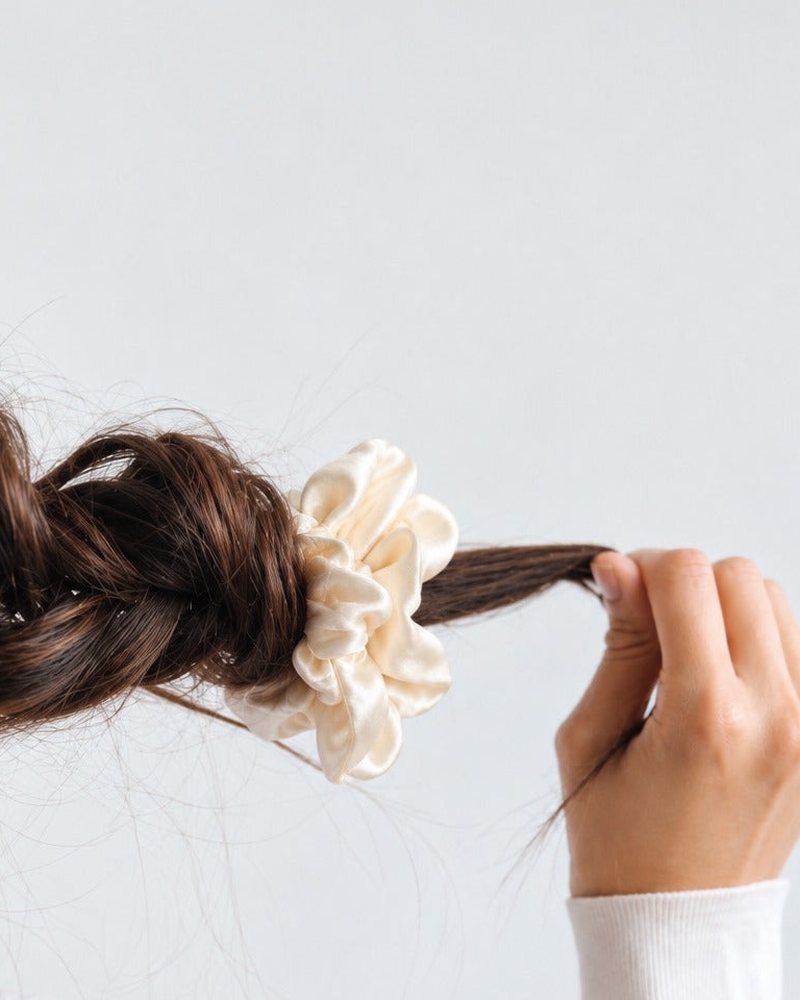 A Candy Dot silk scrunchie holding hair in place