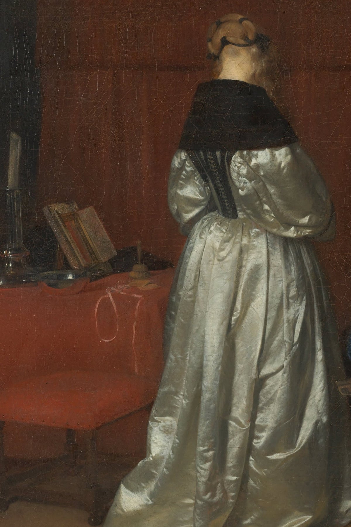 A woman in a shimmering silver-white satin gown, seen from behind, in Gerard ter Borch's painting Gallant Conversation, about 1654