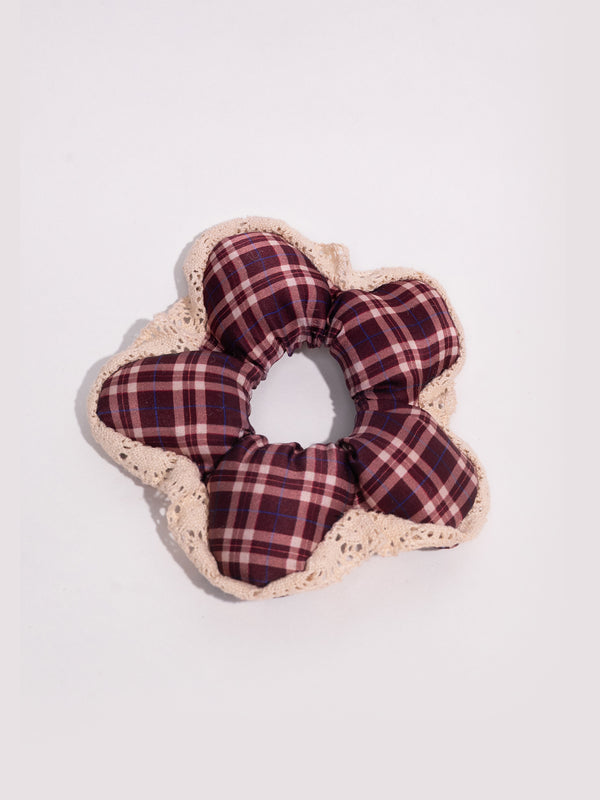 The silk Wildpetal laid flat from above: five maroon plaid mulberry silk petals with a lace edge