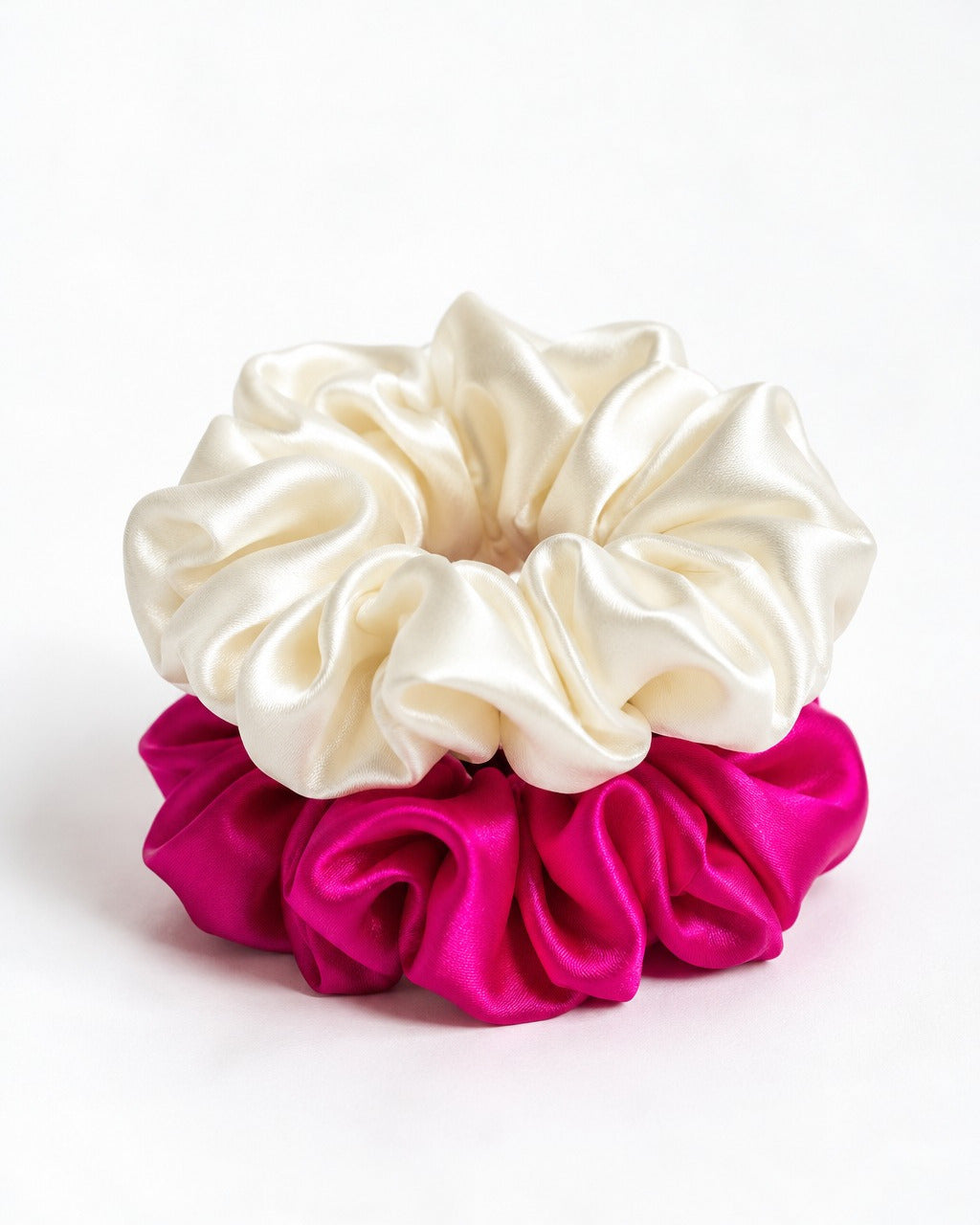 Two Candy Pop mulberry silk scrunchies stacked, Antique White on Hot Pink