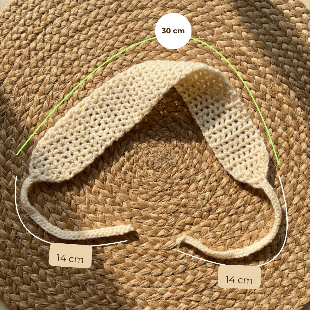 Mellow laid flat on a woven jute mat, measured by hand: the crochet band is 30 cm across, and each tie is 14 cm