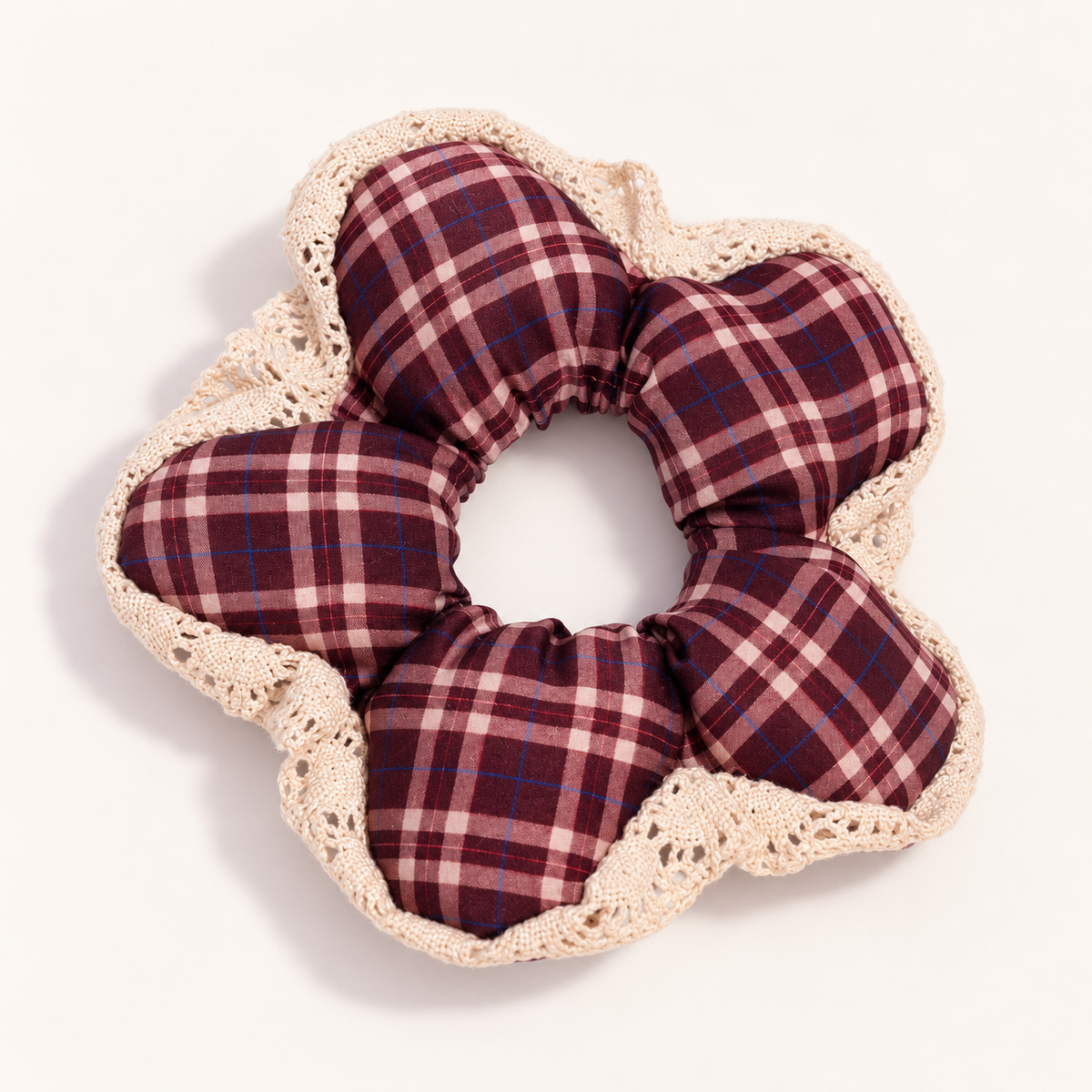 Wildpetal burgundy and pink plaid scrunchie with cream scalloped lace trim on a warm ivory studio background